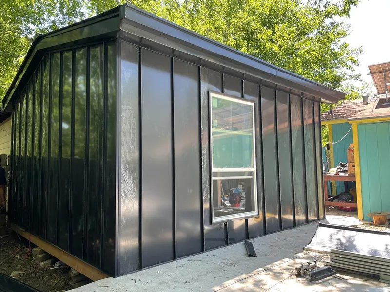 Black standing seam metal wall panels for Roof Inspection in Park Hills