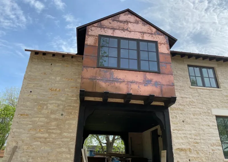 Copper metal panel facade on a stone building for Metal Roof Coating in Park Hills
