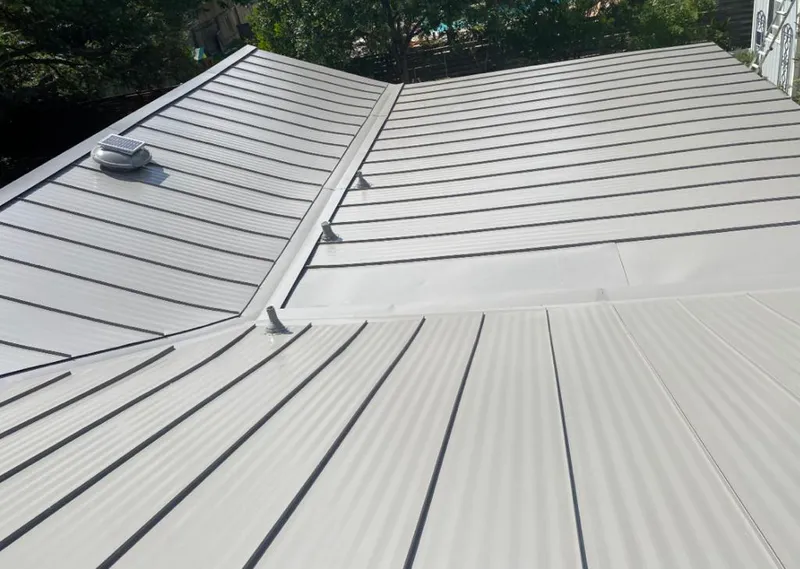 Solar attic fan installed on a metal roof for Roof Ventilation in Park Hills